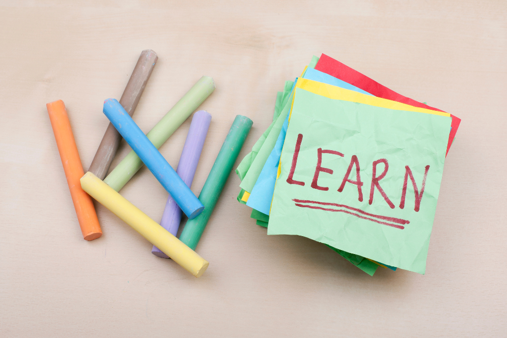 Colourful Chalk and “Learn” Note on Desk